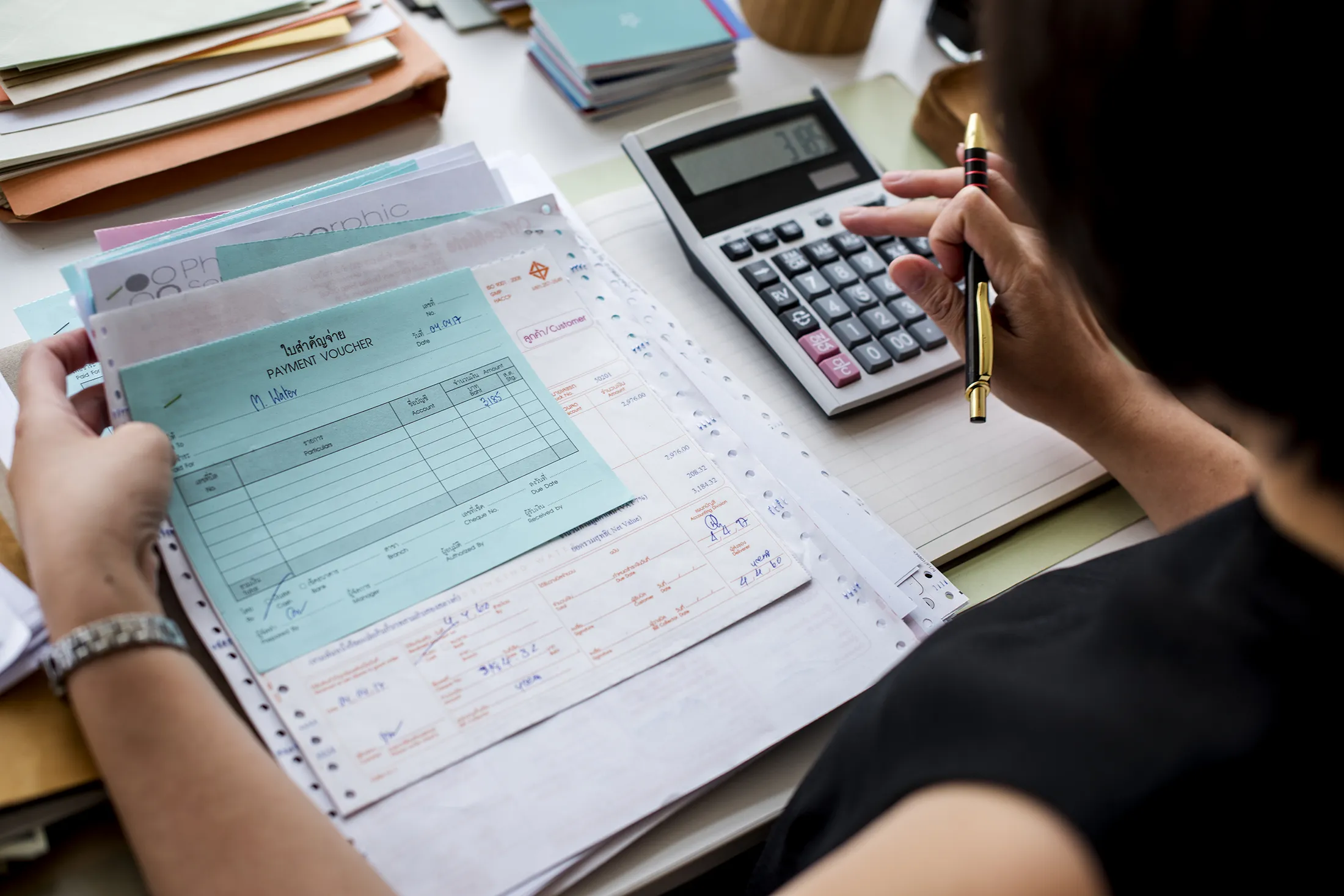 Woman working through paperwork