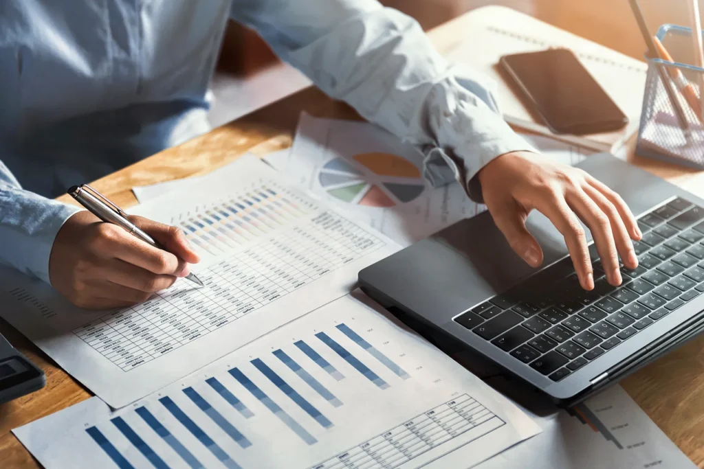 businesswoman working desk using laptop check data finance office